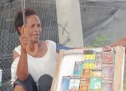 A WIDOW MOTHER SELLS CIGARETTES ON THE ROADSIDE TO MEET HER NEEDS